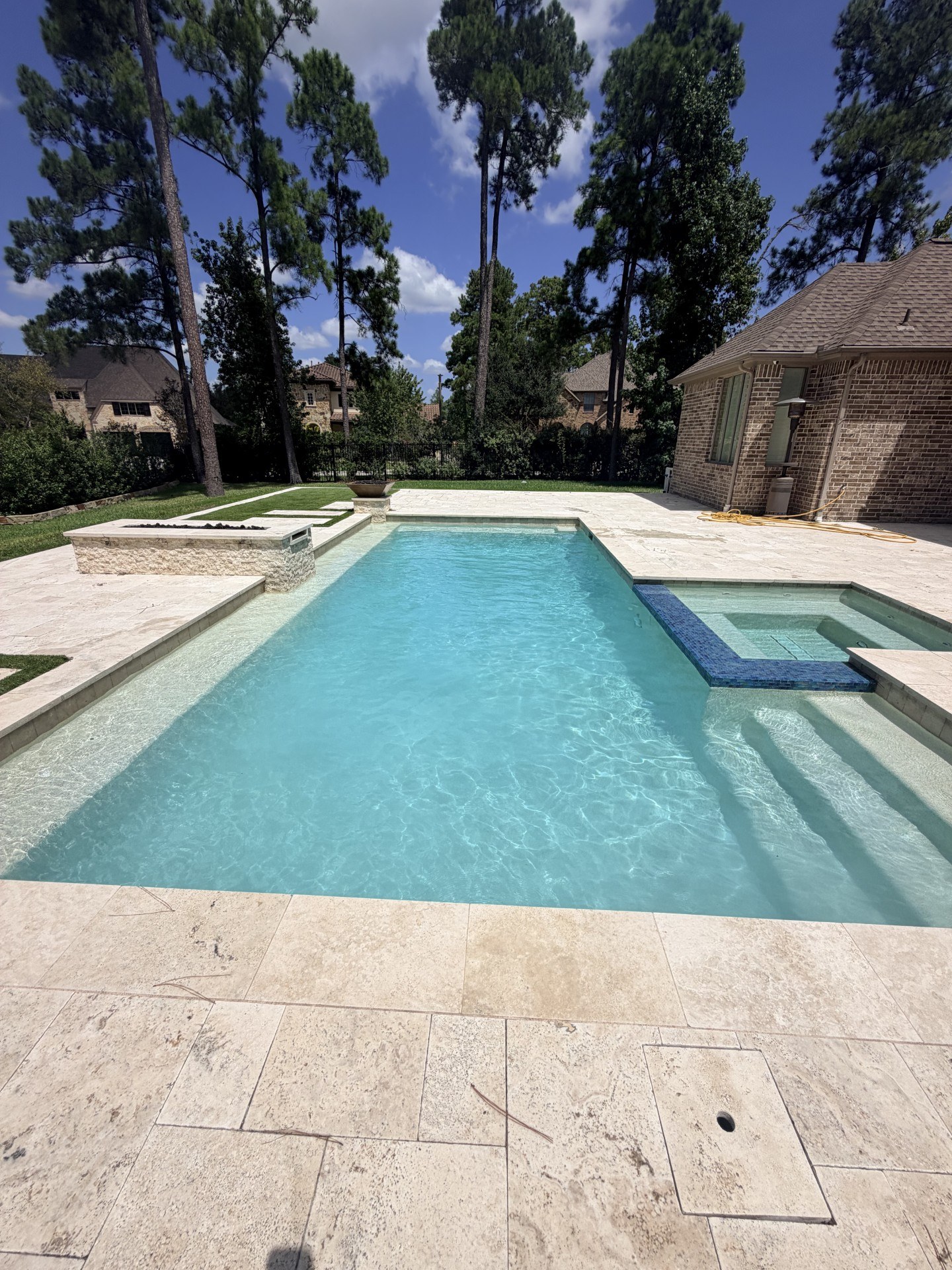 Modern rectangular swimming pool with adjoining spa
